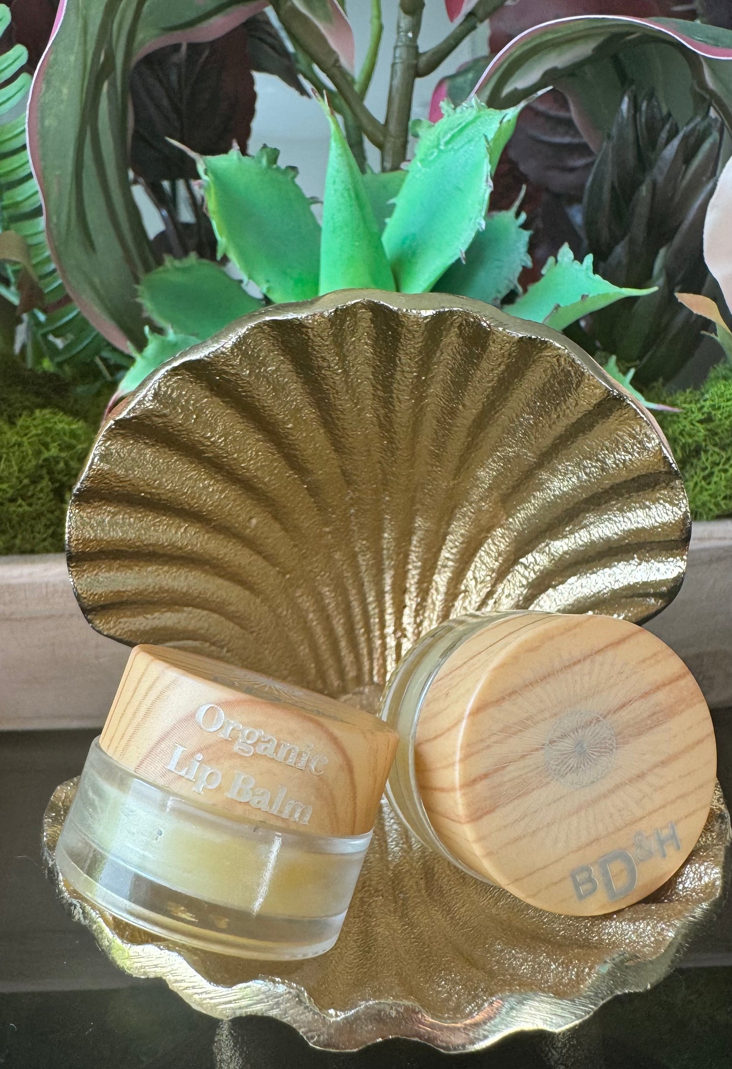 Organic soothing lip balm in a 5ml jar, handmade with 100% water-free raw botanicals and candelilla wax locally in McKinney Texas.