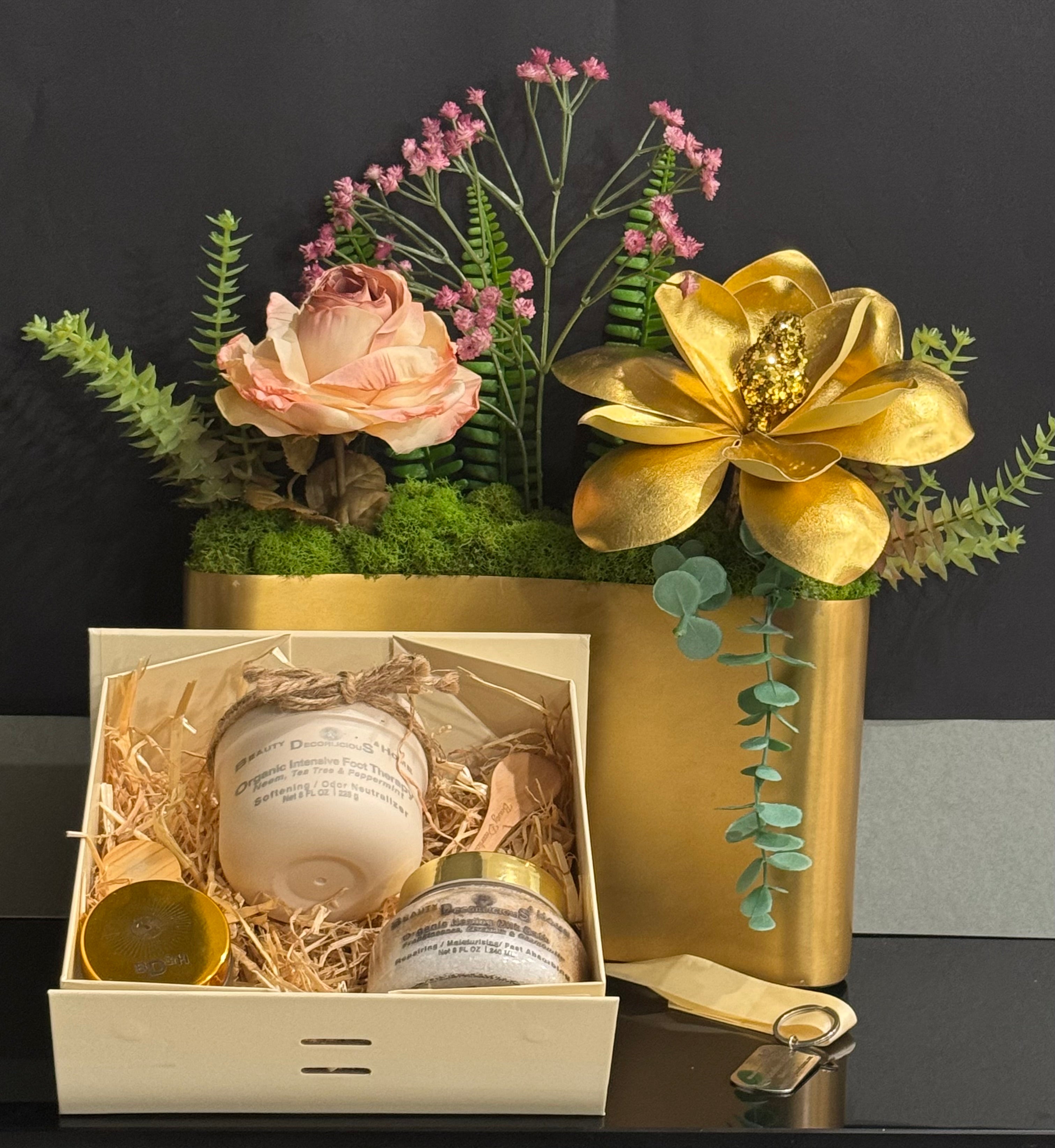 Personalized luxury gift box with a striking gold Petale d'or flower centerpiece, custom engraved home decor, and handmade organic wellness products from Texas.
